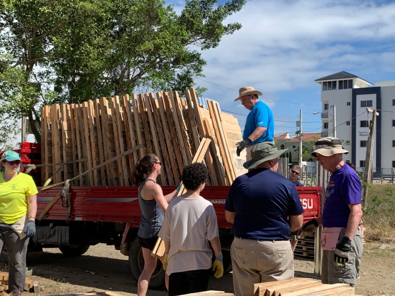 Loading latrine materials in a truck to be transported to the job site to be built. 2019
