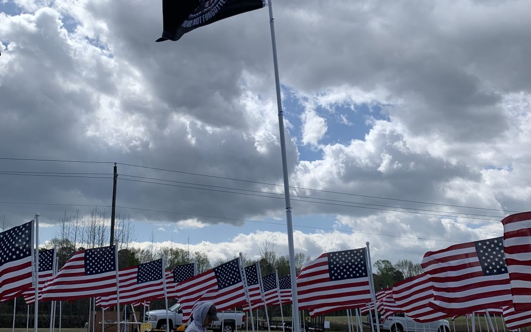 JoCo Flags For Heroes Field of Honor in Clayton next to Johnston Health Hospital. 100 flags raised for Vietnam Veterans Day (March 29, 2022)