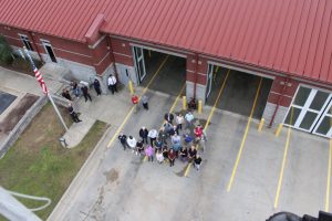 Clayton Rotary Club members and guests from 100 feet up on the Ladder Truck at Clayton Fire Department Station 1