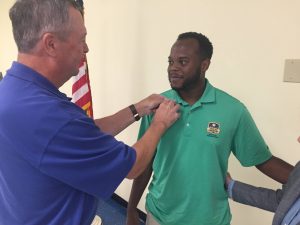 Dre Richmond receives his Rotary pin June 23, 2022